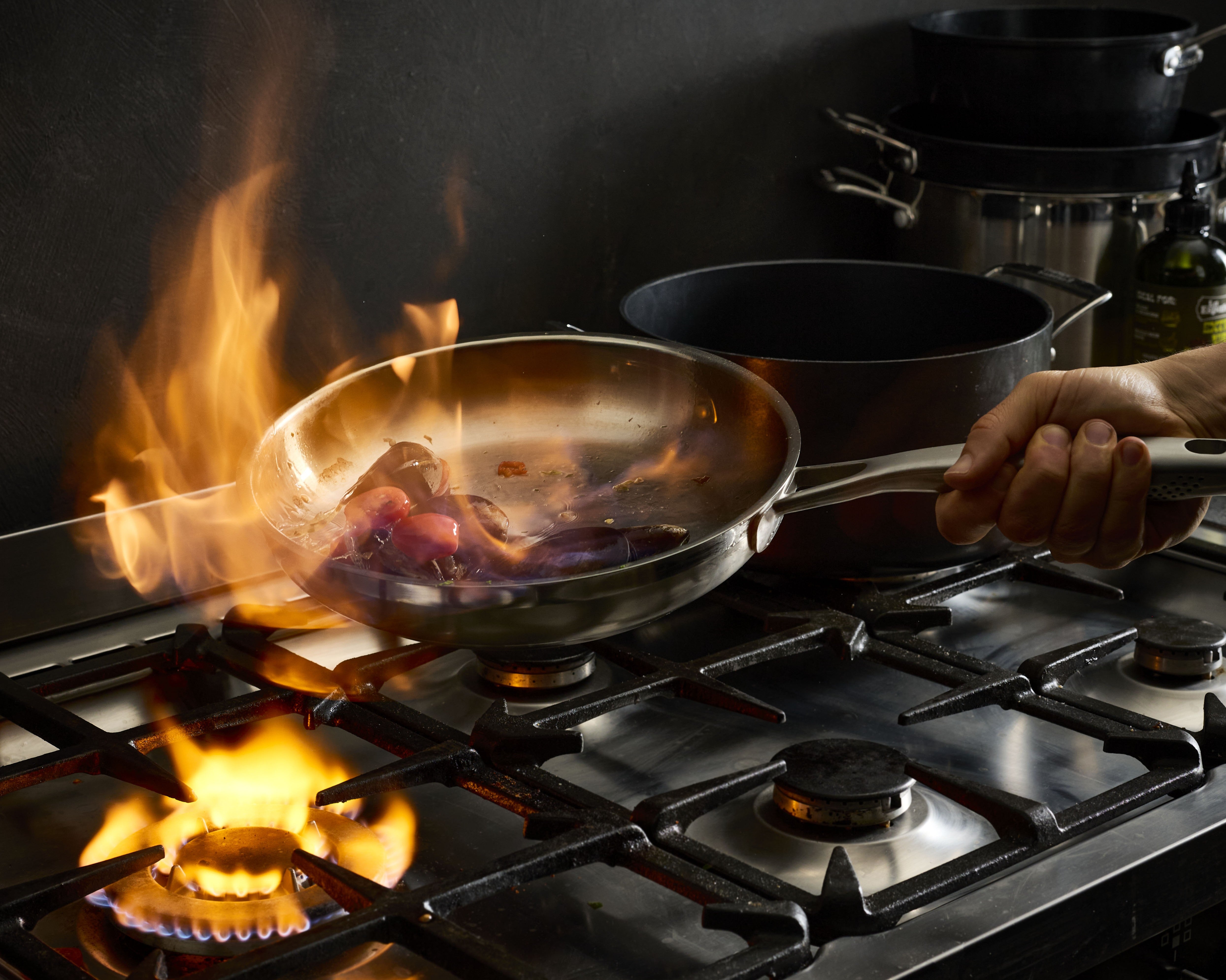 Why does food stick to stainless steel pans