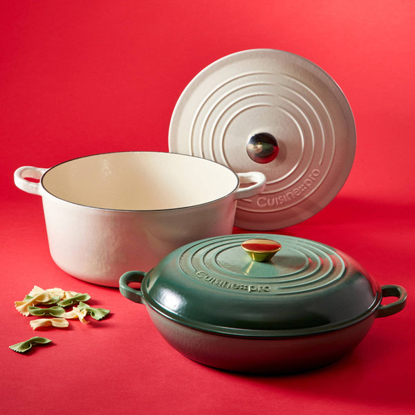 Cuisine::pro® LE CONNOISSEUR™ 6.6 Qt. Round French Oven displayed with its lid on a vibrant red surface.